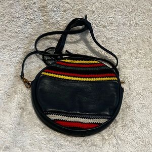 The Sak round navy circular bag with crochet detail